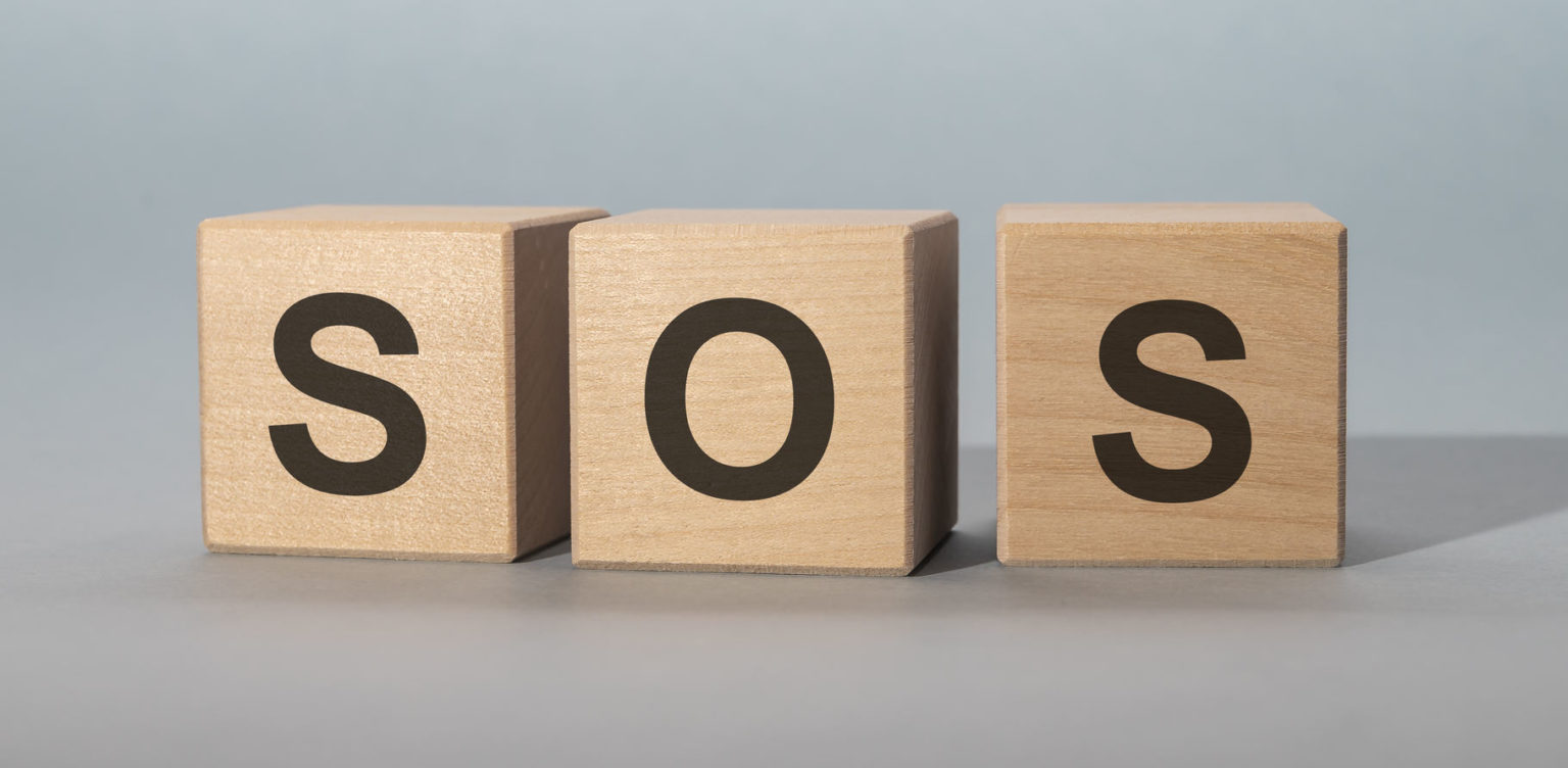 sos on wooden cubes